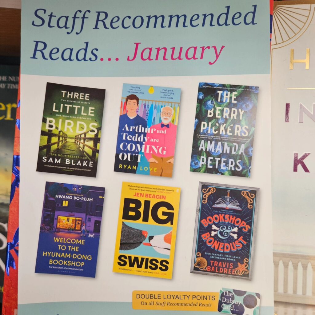 A window poster from a book shop featuring staff book picks
